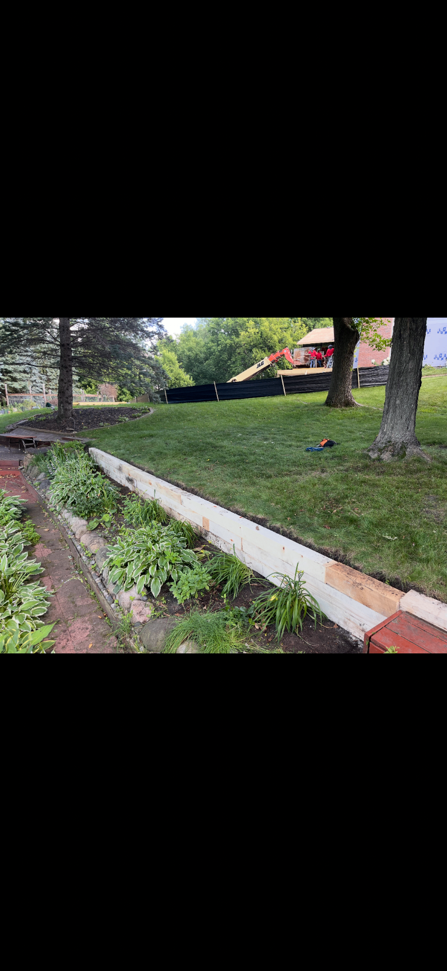 Retaining wall and hosta garden installation in progress